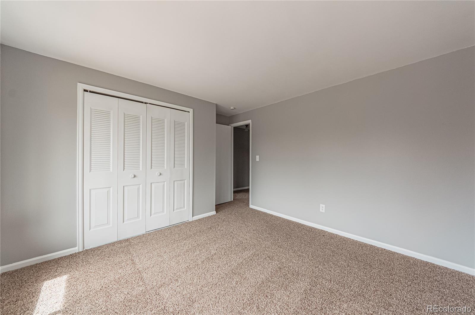 10091 Yates Street Westminster, CO 80031 - Photo 27 of 40 a view of an empty room and closet area