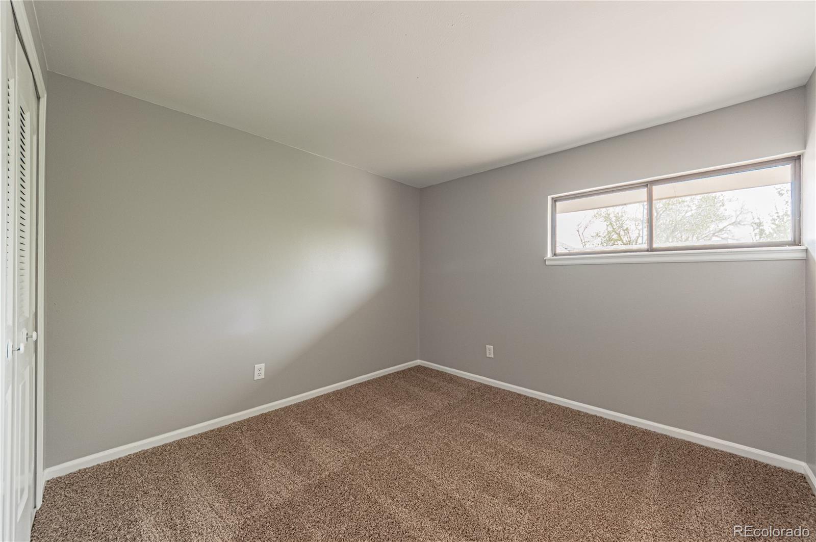 10091 Yates Street Westminster, CO 80031 - Photo 28 of 40 an empty room with windows