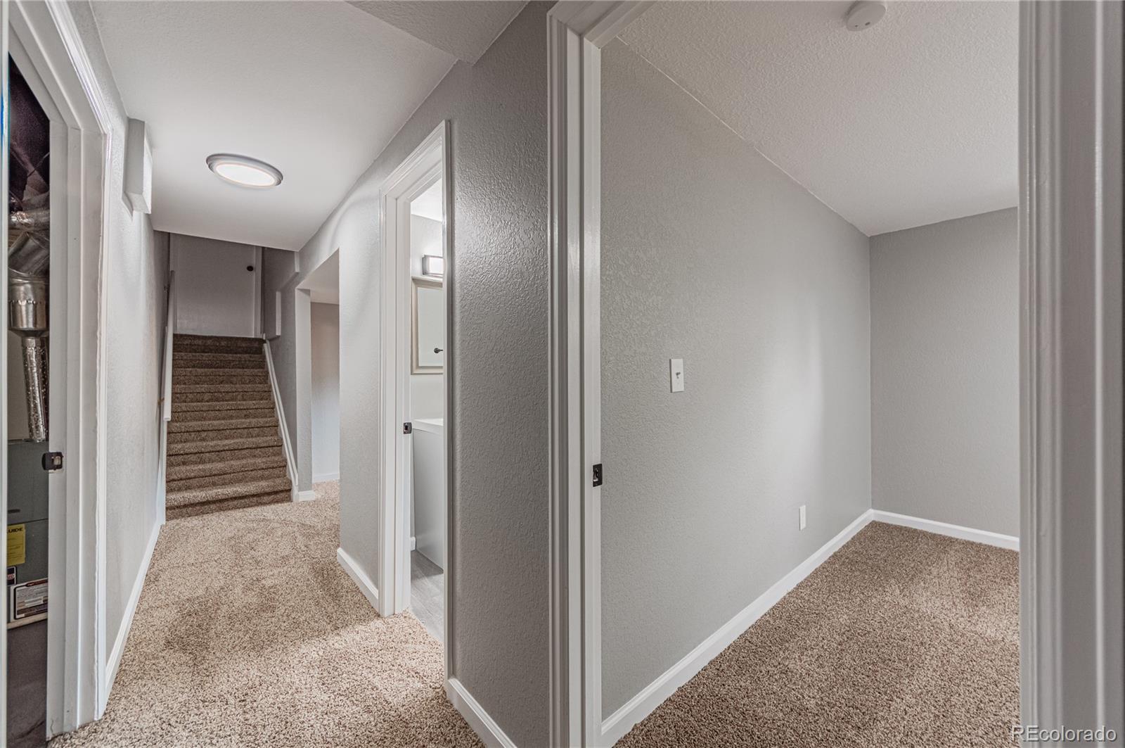 10091 Yates Street Westminster, CO 80031 - Photo 34 of 40 a view of a hallway with wooden floor and entryway