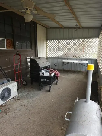 a backyard of a house with outdoor seating