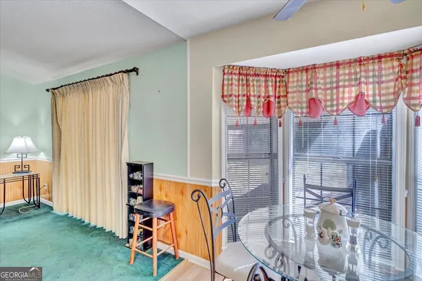 a bedroom with a bed and a dresser in it