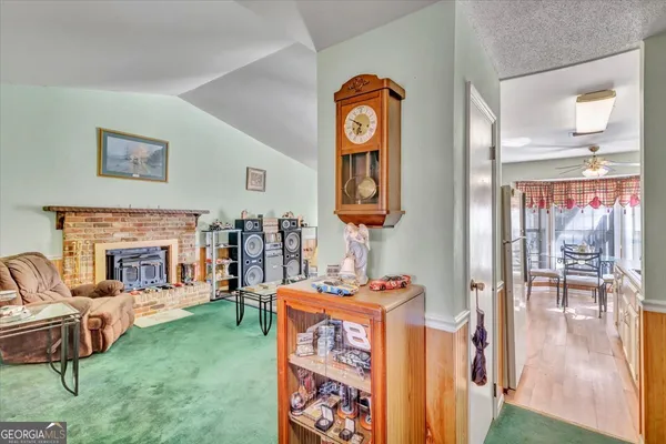 a view of a hallway with entryway front door