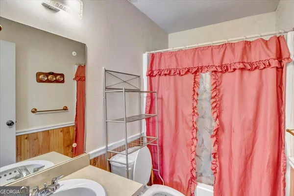 a view of house with outdoor space and swimming pool