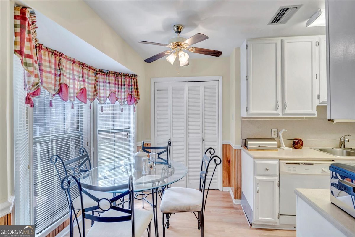 1702 Vada Road Bainbridge, GA 39817 - Photo 6 of 33 a view of a dining room with furniture and chandelier