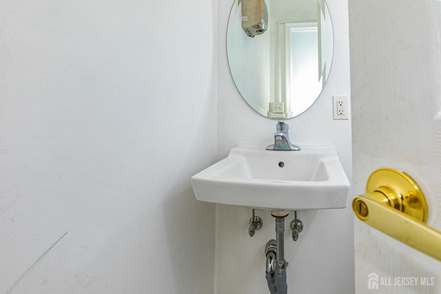 3 Stanworth Road Kendall Park, NJ 08824 - Photo 12 of 22 a bathroom with a sink and a mirror