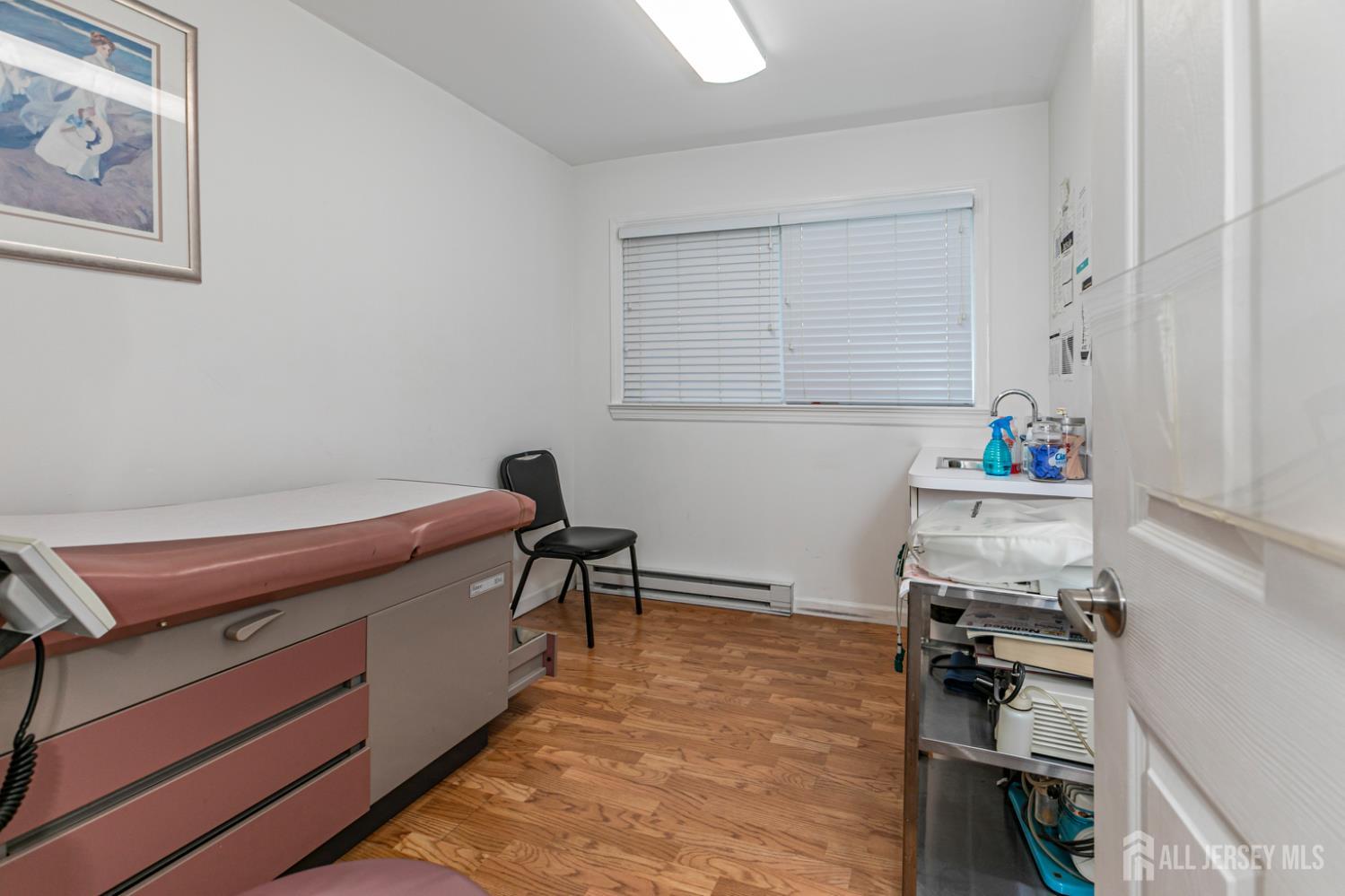 3 Stanworth Road Kendall Park, NJ 08824 - Photo 13 of 22 a reading room with wooden floor and furniture