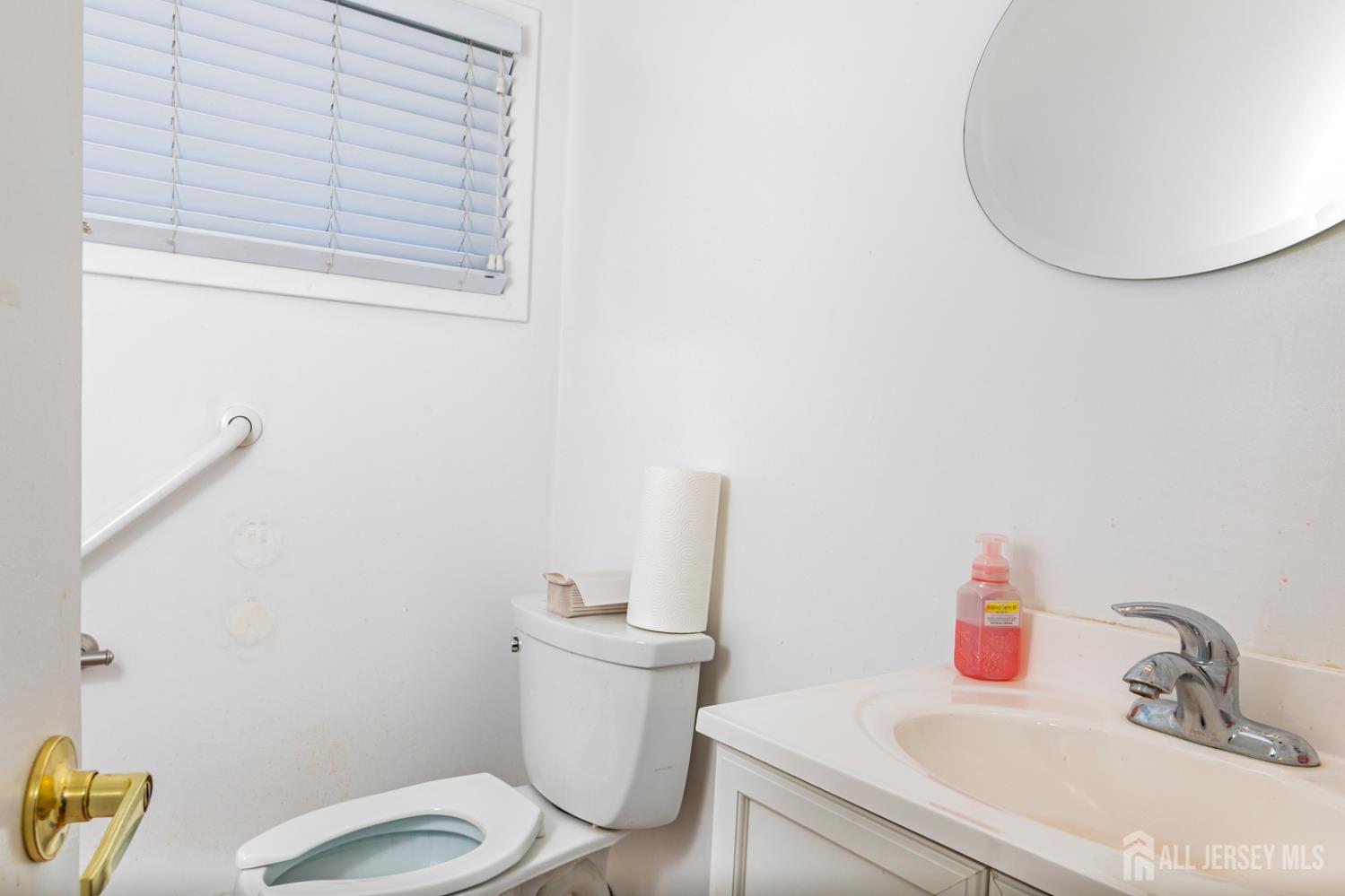 3 Stanworth Road Kendall Park, NJ 08824 - Photo 18 of 22 a bathroom with a sink and a toilet