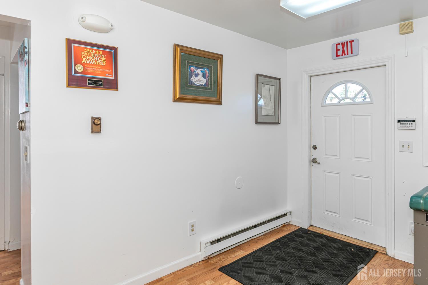 3 Stanworth Road Kendall Park, NJ 08824 - Photo 4 of 22 a view of livingroom with wooden floor and window