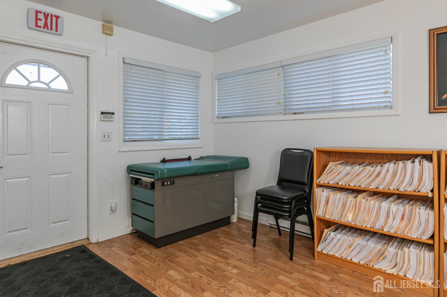 3 Stanworth Road Kendall Park, NJ 08824 - Photo 6 of 22 a room with furniture and a book shelf