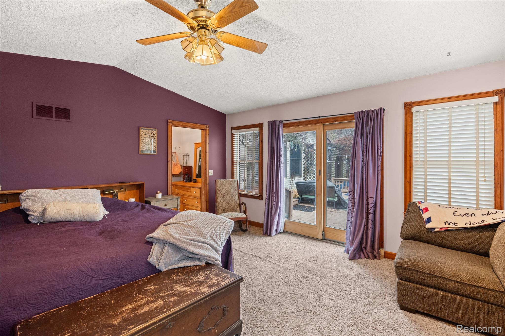 6076 East Carpenter Road Flint, MI 48506 - Photo 24 of 67 Bedroom with access to outside, light carpet, and a ceiling fan