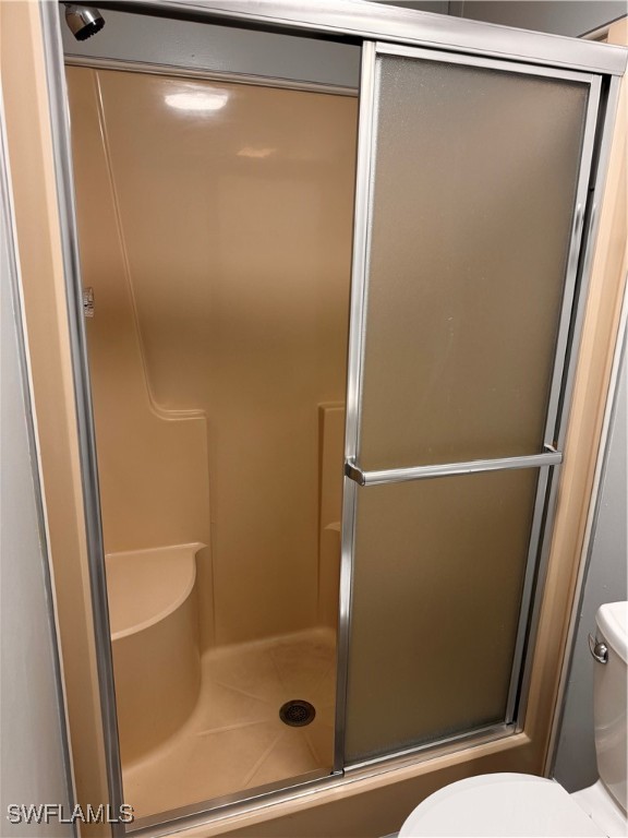 15550 Burnt Store Road, Unit 228 Punta Gorda, FL 33955 - Photo 12 of 40 a bathroom with a glass shower door