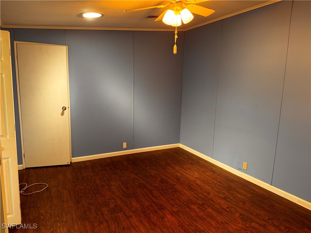 15550 Burnt Store Road, Unit 228 Punta Gorda, FL 33955 - Photo 13 of 40 a view of an empty room with wooden floor