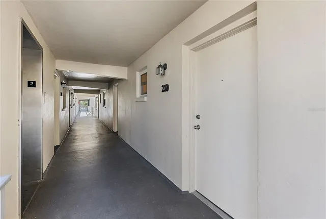 a view of a livingroom with furniture and a workspace