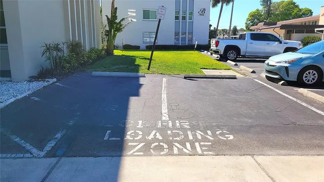 an aerial view of a city with lots of residential buildings ocean and mountain view