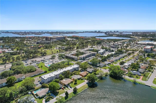 an aerial view of residential building and ocean
