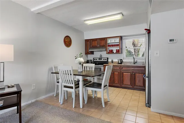 a kitchen with a table and chairs in it