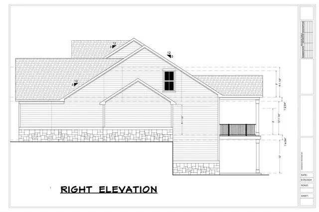 aerial view of a house with a yard and lake view