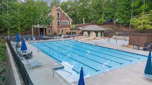 a view of a house with backyard sitting area and garden