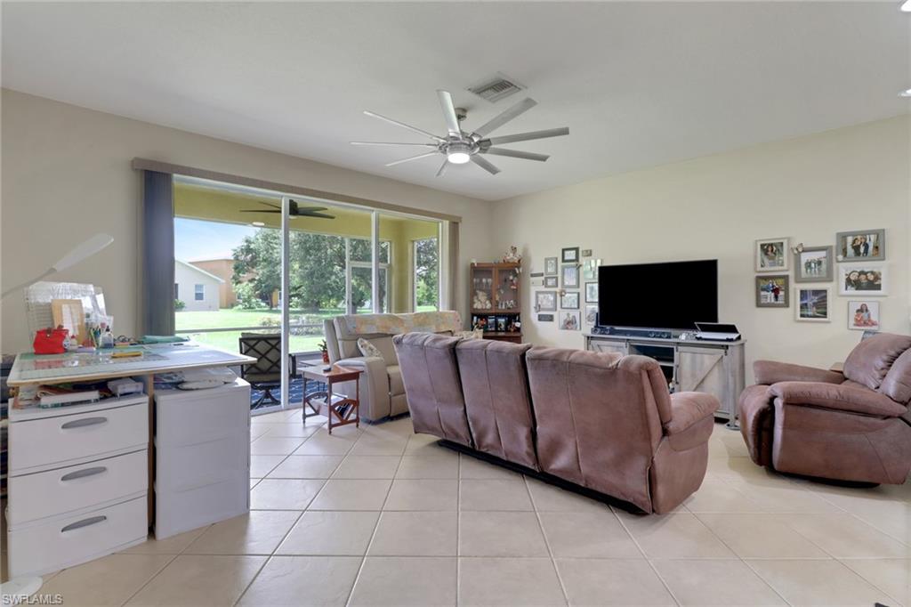 14174 Danpark Loop Fort Myers, FL 33912 - Photo 11 of 20 a living room with furniture and a flat screen tv