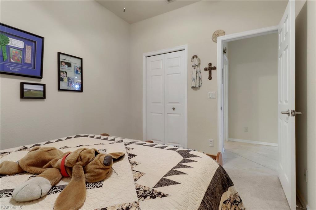 14174 Danpark Loop Fort Myers, FL 33912 - Photo 13 of 20 a bedroom with a bed and closet