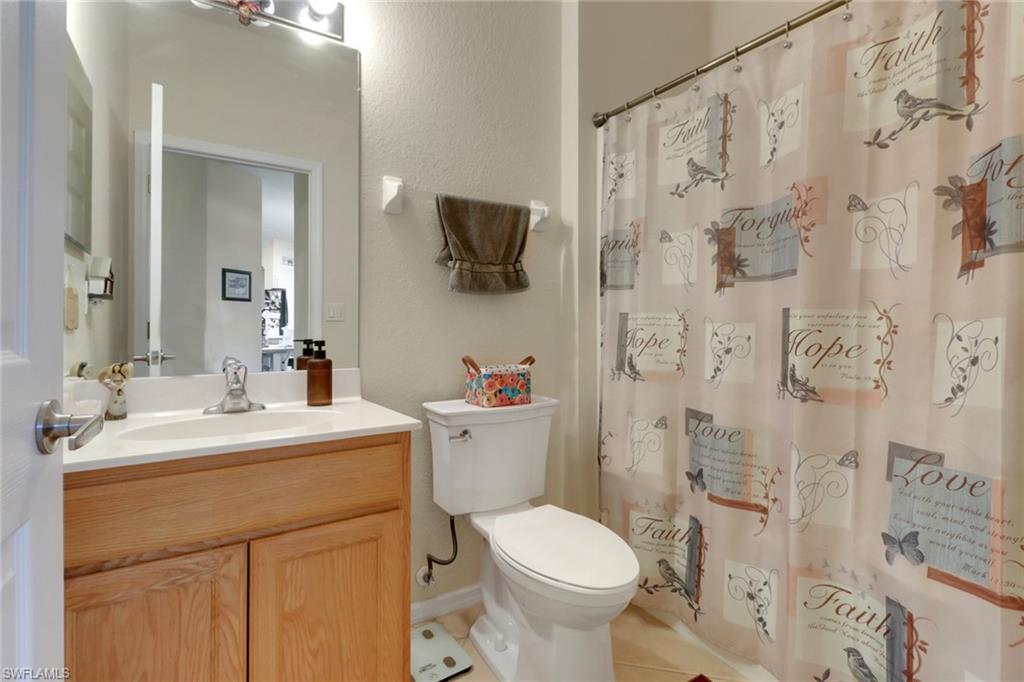 14174 Danpark Loop Fort Myers, FL 33912 - Photo 14 of 20 a bathroom with a sink toilet vanity and shower