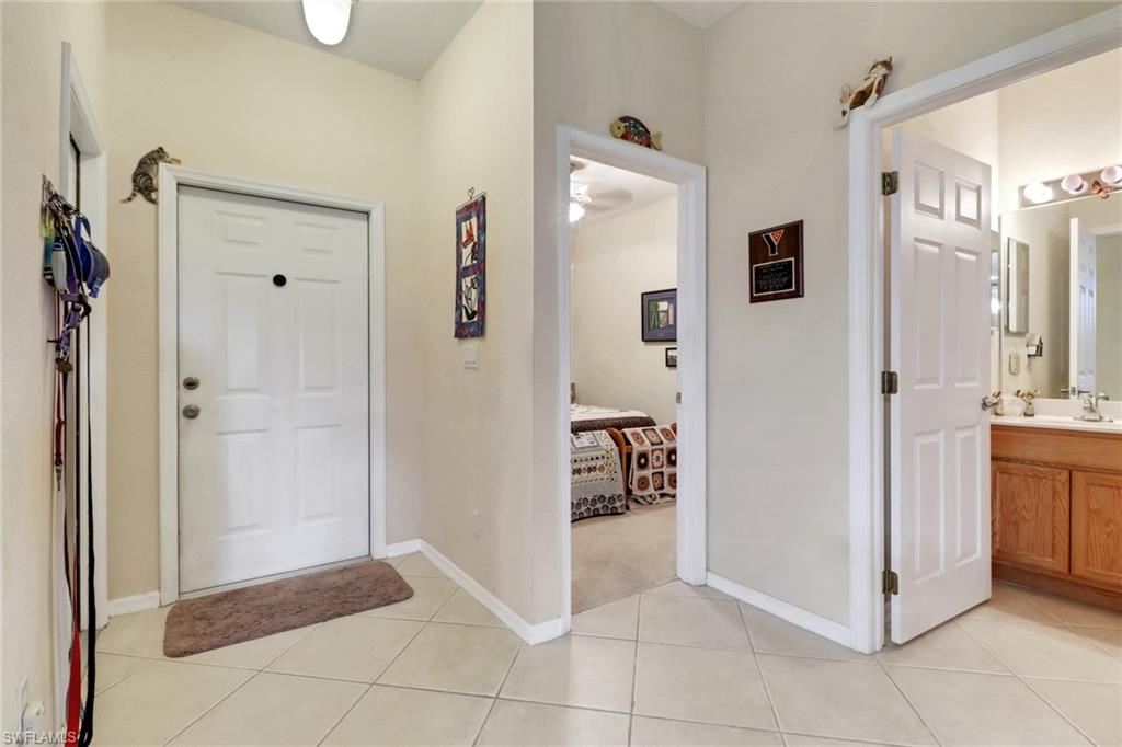 14174 Danpark Loop Fort Myers, FL 33912 - Photo 2 of 20 a view of a hallway with closet and a living room