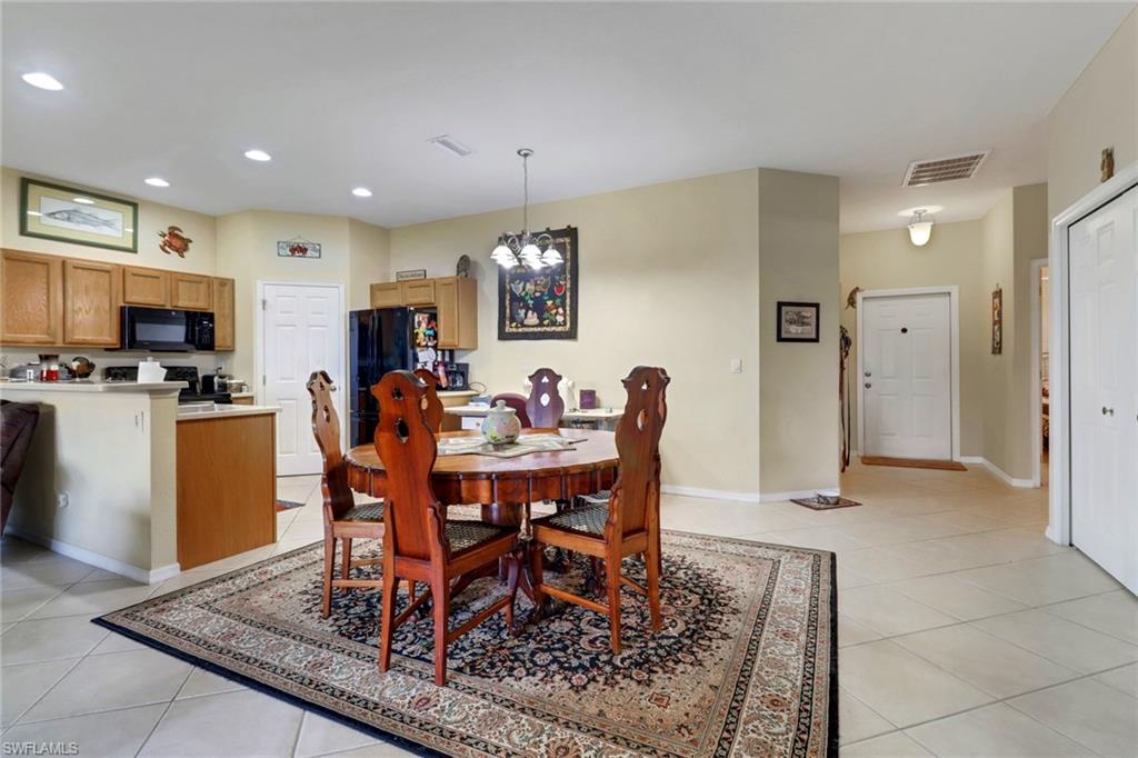 14174 Danpark Loop Fort Myers, FL 33912 - Photo 3 of 20 a view of a dining room with furniture
