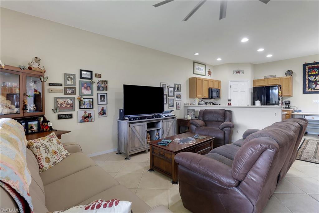 14174 Danpark Loop Fort Myers, FL 33912 - Photo 9 of 20 a living room with furniture and a flat screen tv