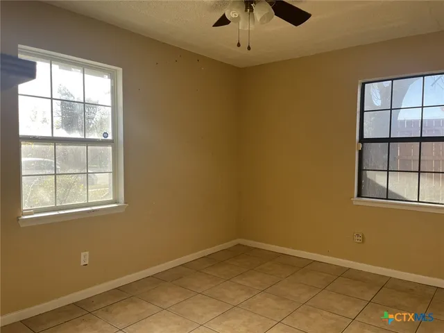 an empty room with windows