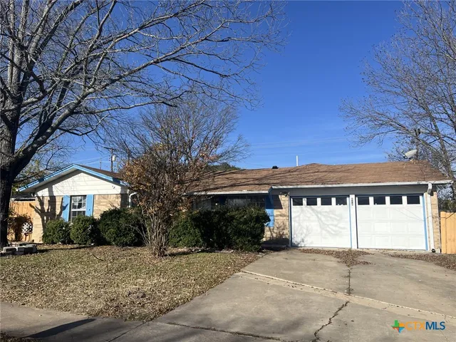 a view of a house with a street