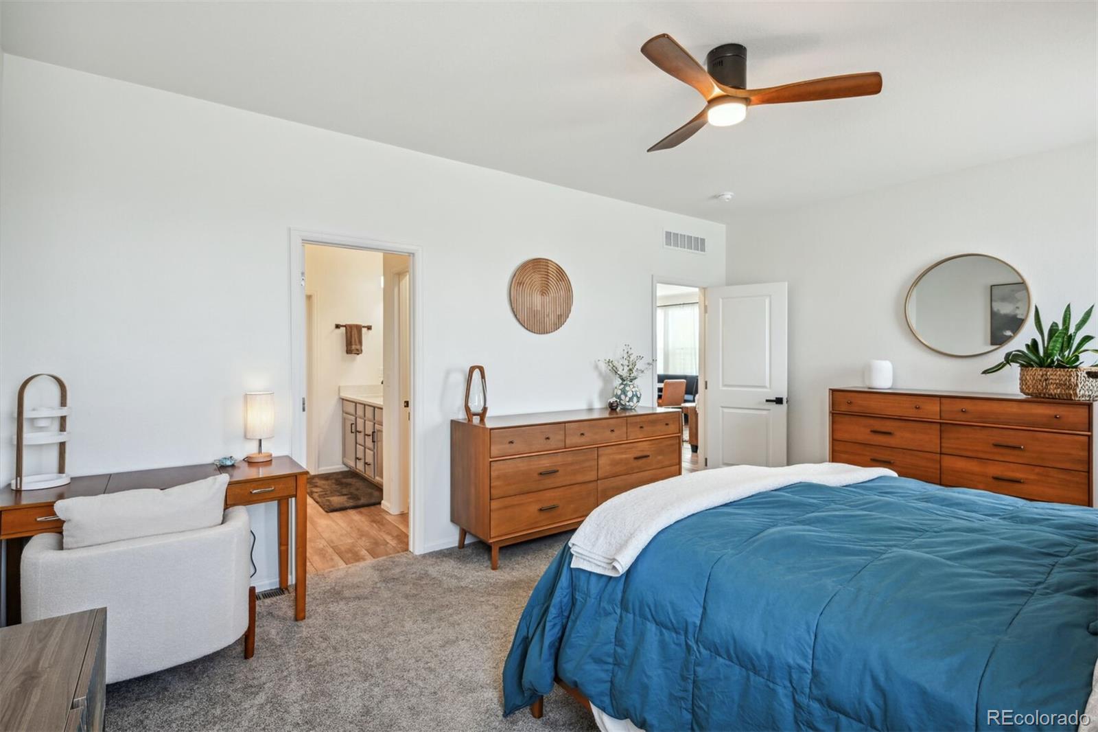 347 Felicity Loop Castle Rock, CO 80109 - Photo 13 of 28 a bedroom with a bed and a dresser