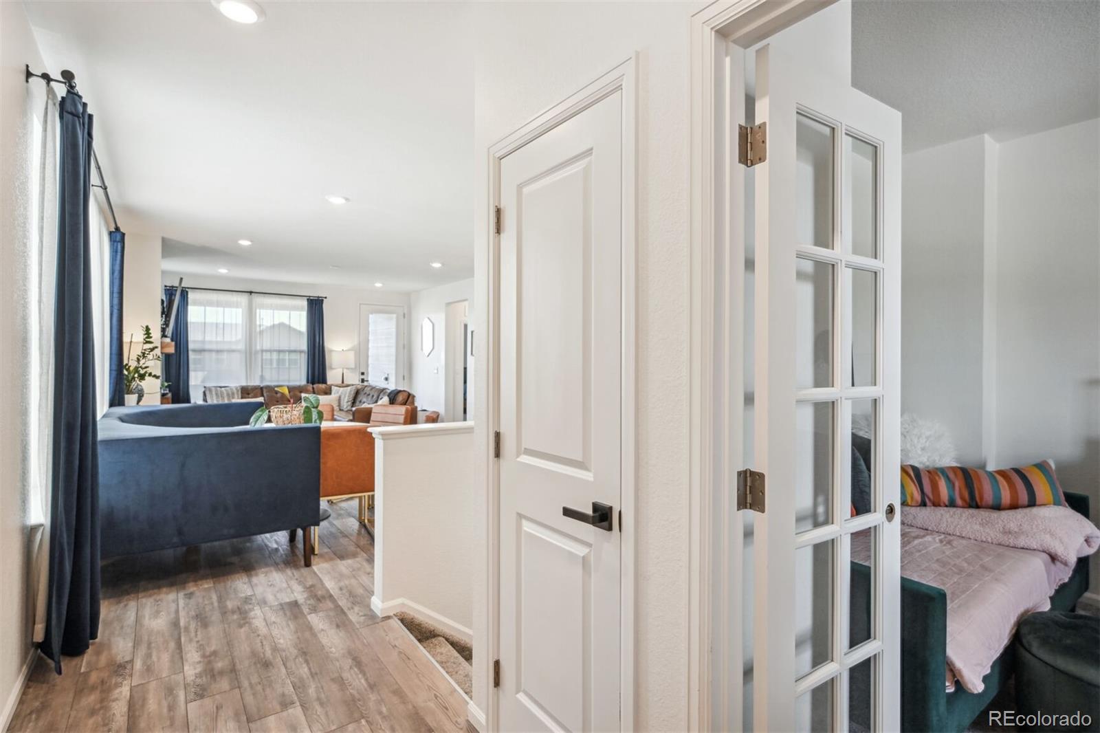 347 Felicity Loop Castle Rock, CO 80109 - Photo 6 of 28 a room with a window and a wooden floor