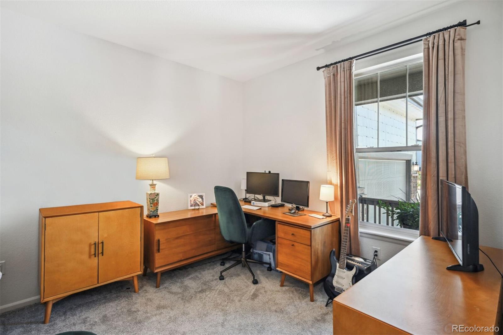 347 Felicity Loop Castle Rock, CO 80109 - Photo 8 of 28 a view of a workspace with furniture and a window