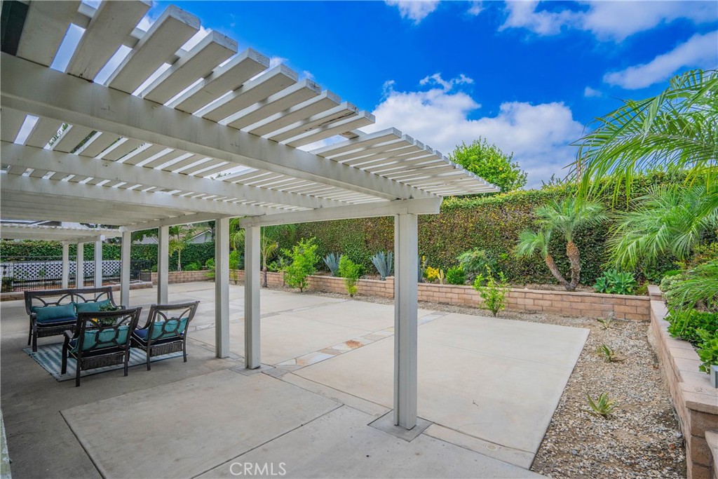 1301 Eltham Place Fullerton, CA 92833 - Photo 22 of 26 a view of a patio with table and chairs and potted plants