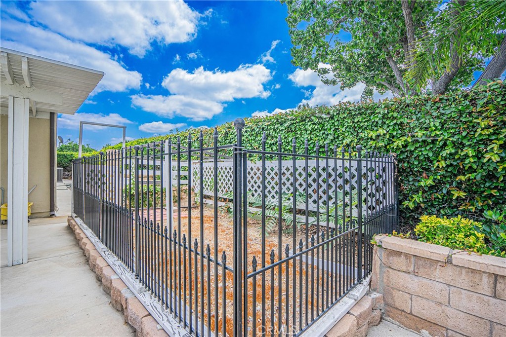 1301 Eltham Place Fullerton, CA 92833 - Photo 25 of 26 a view of a wrought iron fences in front of house
