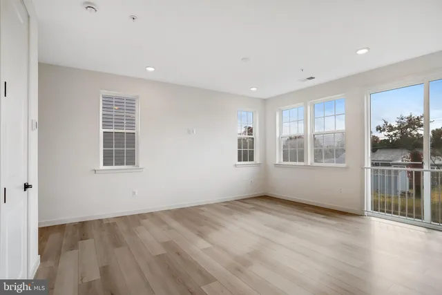 a kitchen with stainless steel appliances sink refrigerator and cabinets