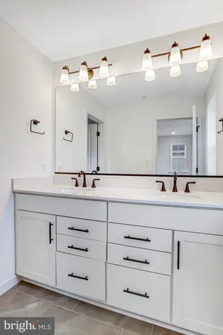 a view of a hallway with a closet and a window