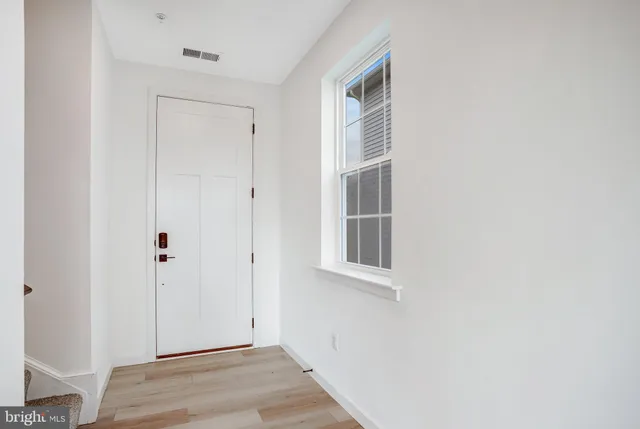 a view of staircase with white walls