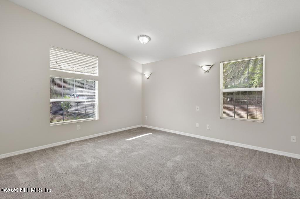 10803 Gladwynne Road Jacksonville, FL 32218 - Photo 12 of 44 an empty room with a window