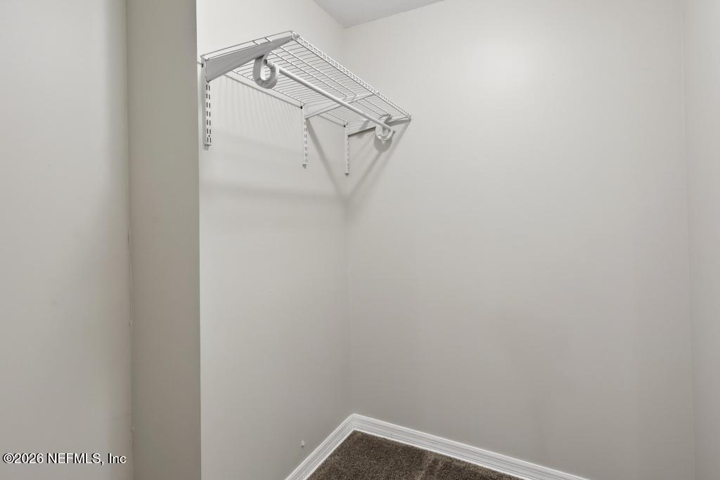 10803 Gladwynne Road Jacksonville, FL 32218 - Photo 17 of 44 a view of small space with racks on the wall