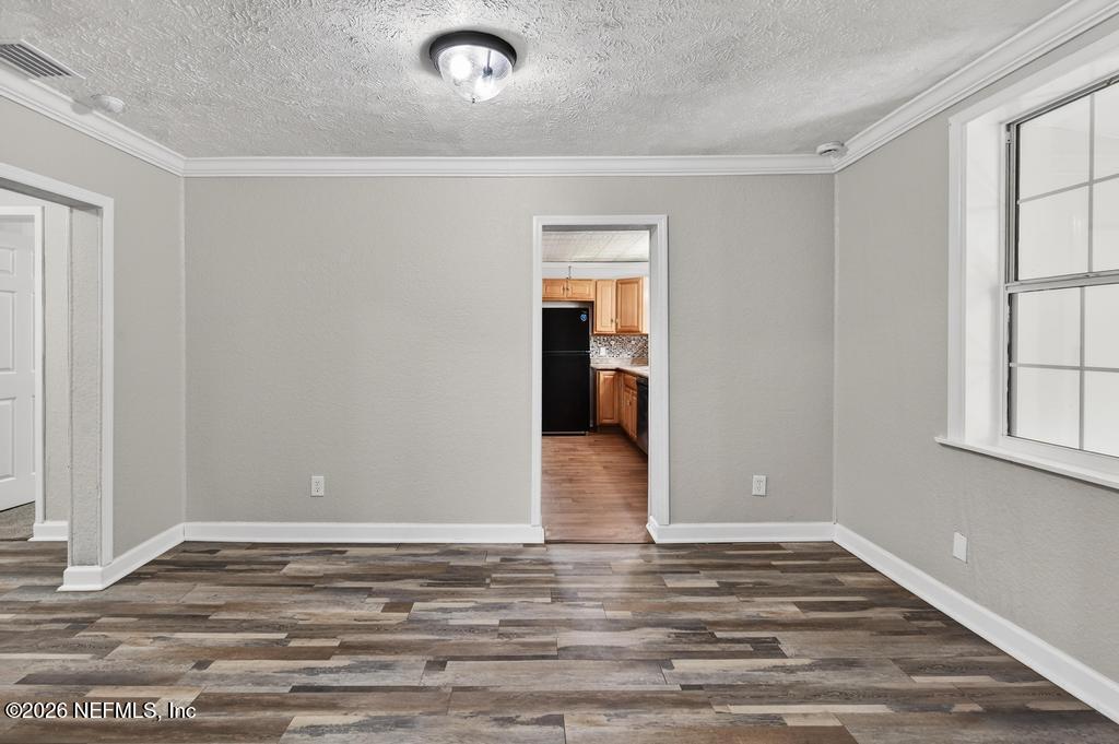 10803 Gladwynne Road Jacksonville, FL 32218 - Photo 22 of 44 wooden floor in an empty room with a window