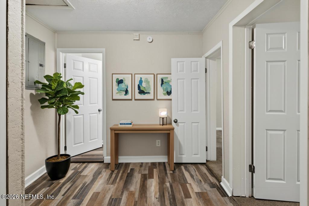 10803 Gladwynne Road Jacksonville, FL 32218 - Photo 23 of 44 a view of a room with wooden floor and a potted plant