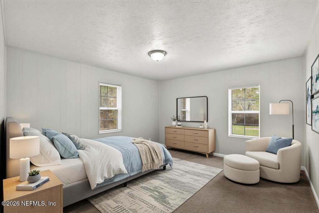 10803 Gladwynne Road Jacksonville, FL 32218 - Photo 26 of 44 a bedroom with bed and window