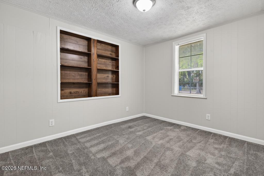 10803 Gladwynne Road Jacksonville, FL 32218 - Photo 31 of 44 a view of an empty room with a window