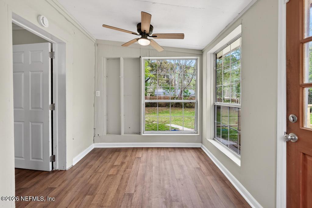 10803 Gladwynne Road Jacksonville, FL 32218 - Photo 37 of 44 a view of empty room with wooden floor and fan