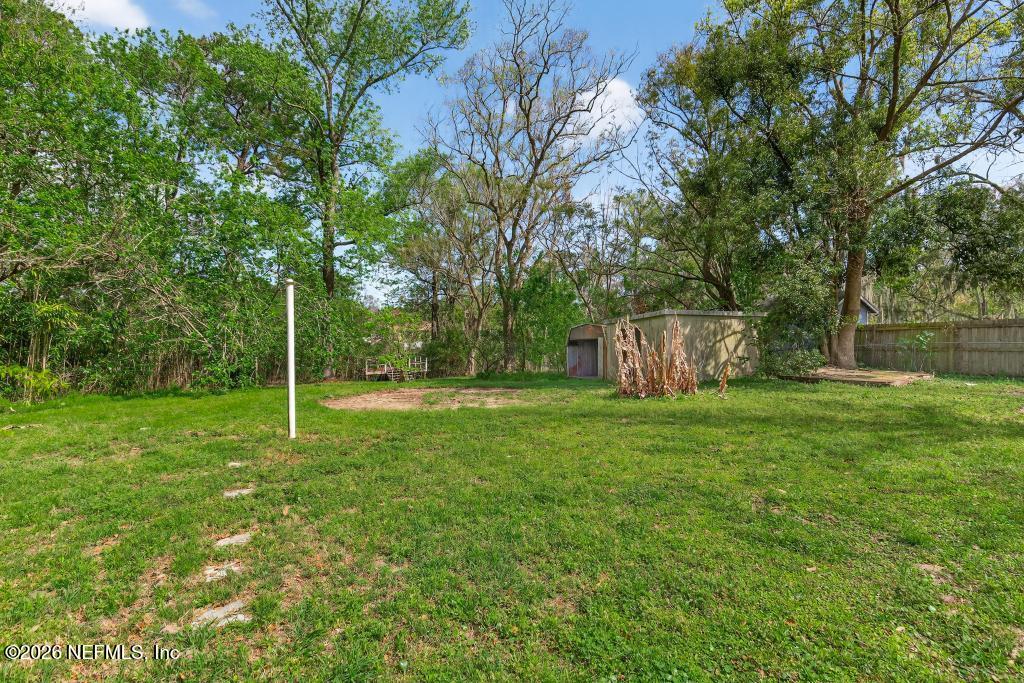 10803 Gladwynne Road Jacksonville, FL 32218 - Photo 42 of 44 a view of a backyard with large trees