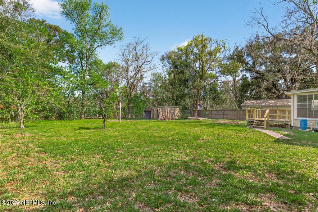 10803 Gladwynne Road Jacksonville, FL 32218 - Photo 43 of 44 a view of a house with a backyard