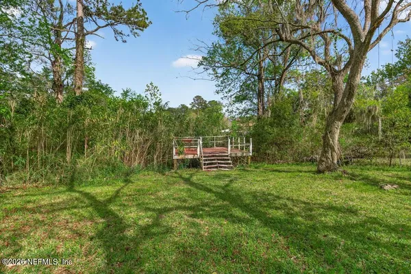 a backyard of a house with lots of green space