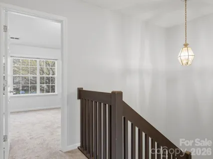 a view of a hallway with windows