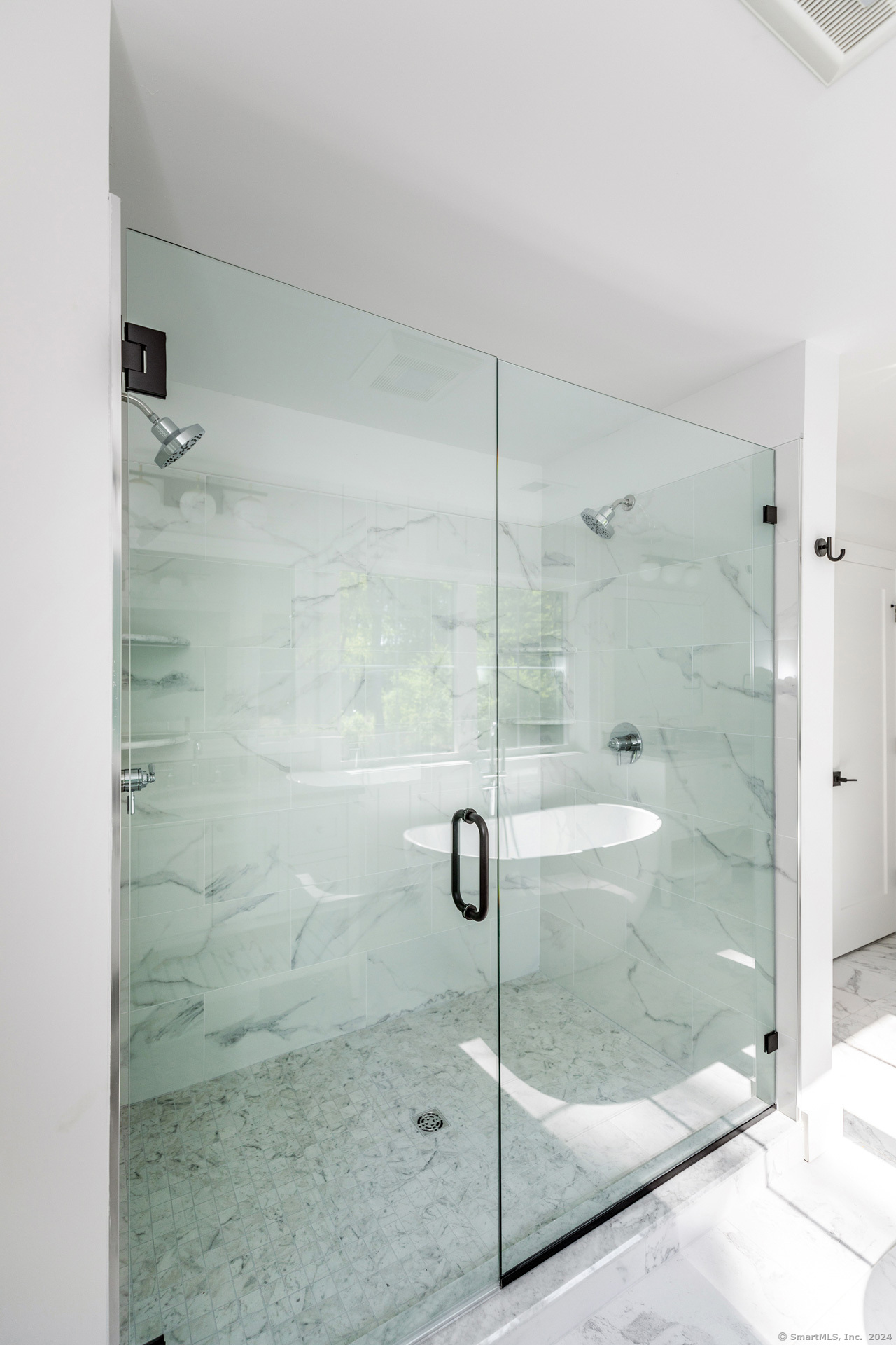 18 Sebastian Trail Newtown, CT 06470 - Photo 22 of 22 a bathroom with a glass shower door